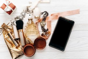 luxury expensive jewelry and make up essentials and perfume flat lay