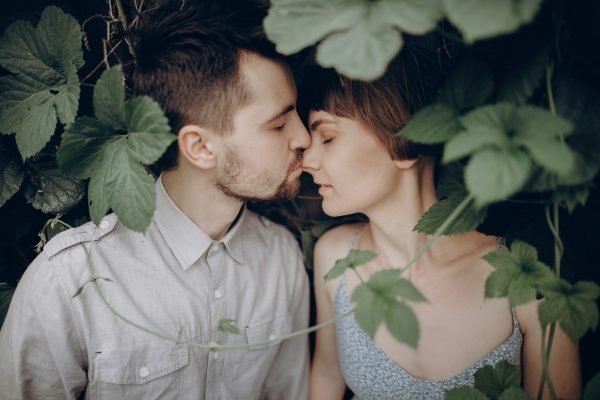 stylish-hipster-couple-kissing-in-green-leaves-holding-hands.jpg Mock Wedding Basic
